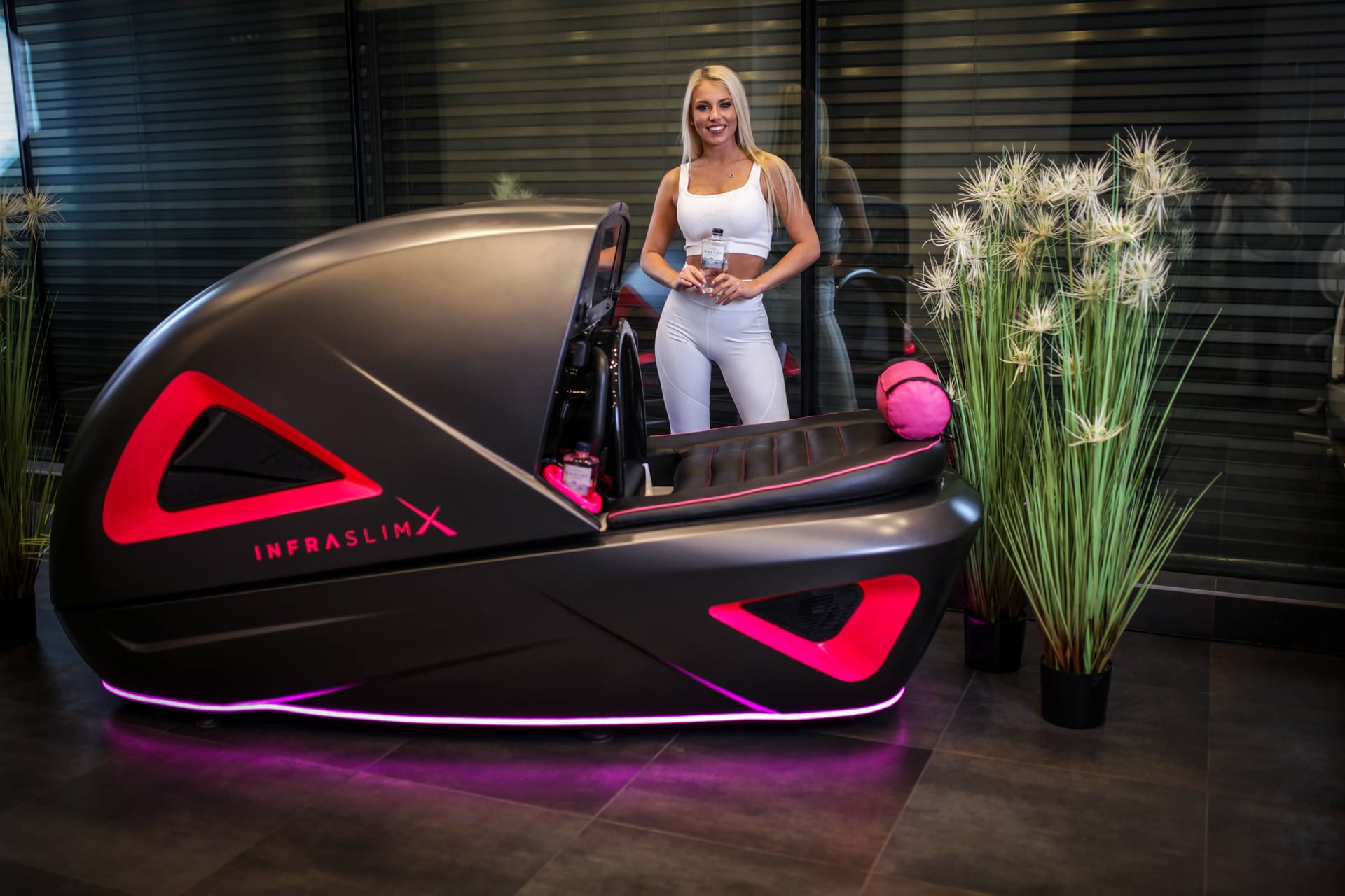 Client standing behind InfraSlimX machine